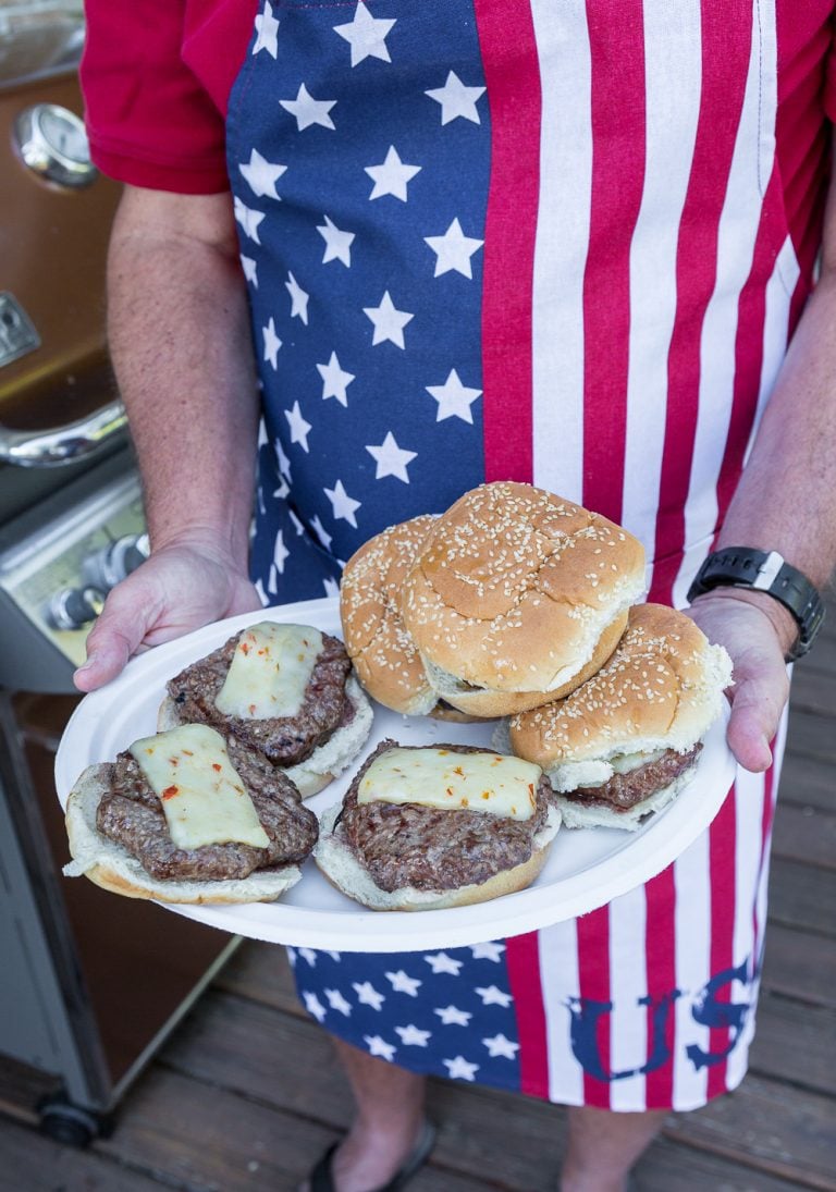 serving cheeseburgers on a Chinet White Colllection platter