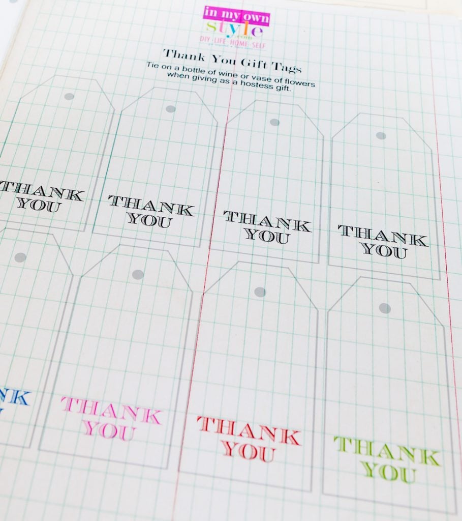 a sheet of printed free printable gift tags ready to get cut