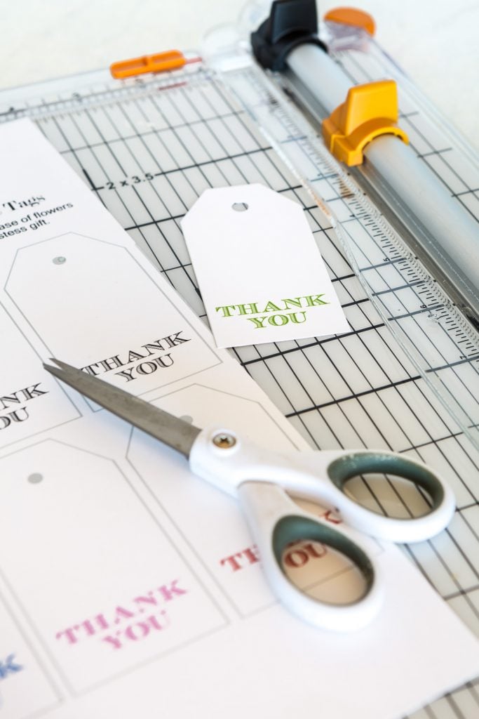 a pair of scissors ready to cut out free printable thank you gift tags