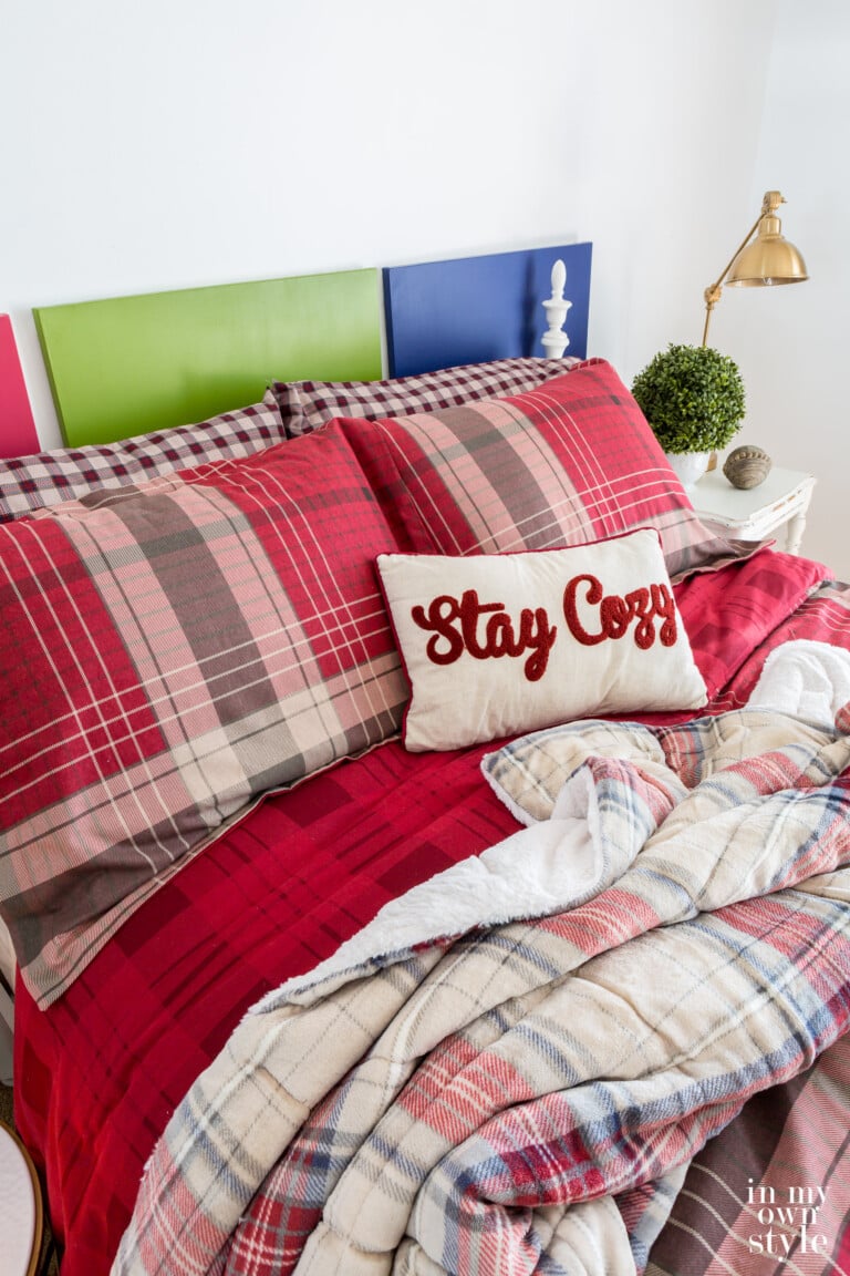 CuddlDuds Red Plaid bedding from Kohls on bed in a guest room.