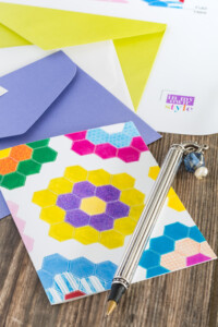 Free printable note card of a colorful quilt block design of grandmother's garden