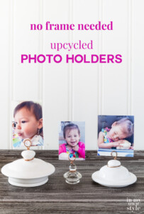 3 teapot lid and jar lid photo holders lined up on a table. Text overlay says no frame needed upcycled photo holders.