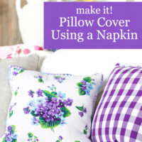 pretty floral pillows on white sofa made using cloth napkins.