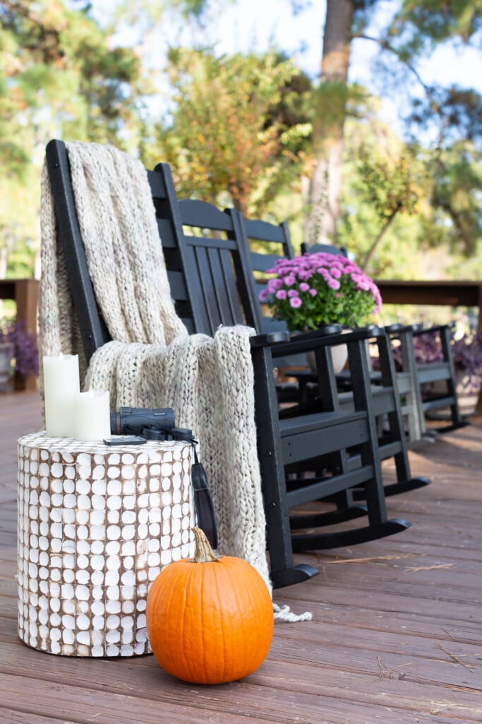 cozy fall on the deck line up of black Polywood rocking chairs