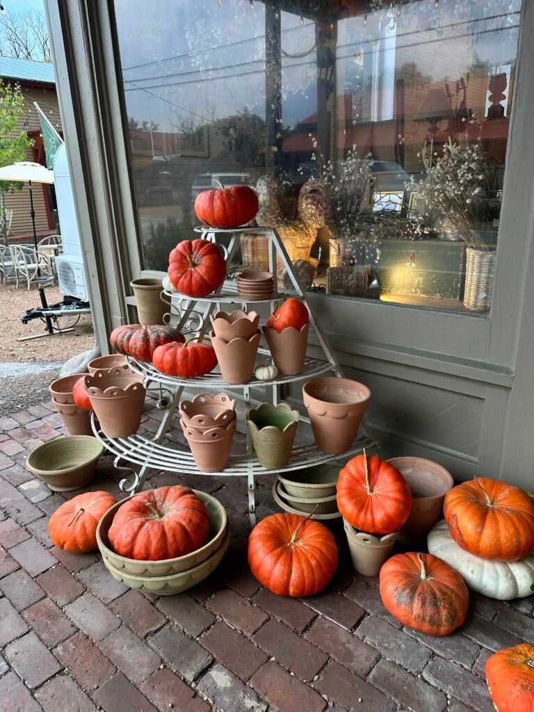 pumpkins on display in front of a store