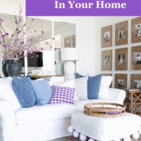 white furniture in a living room with blue and purple accents.