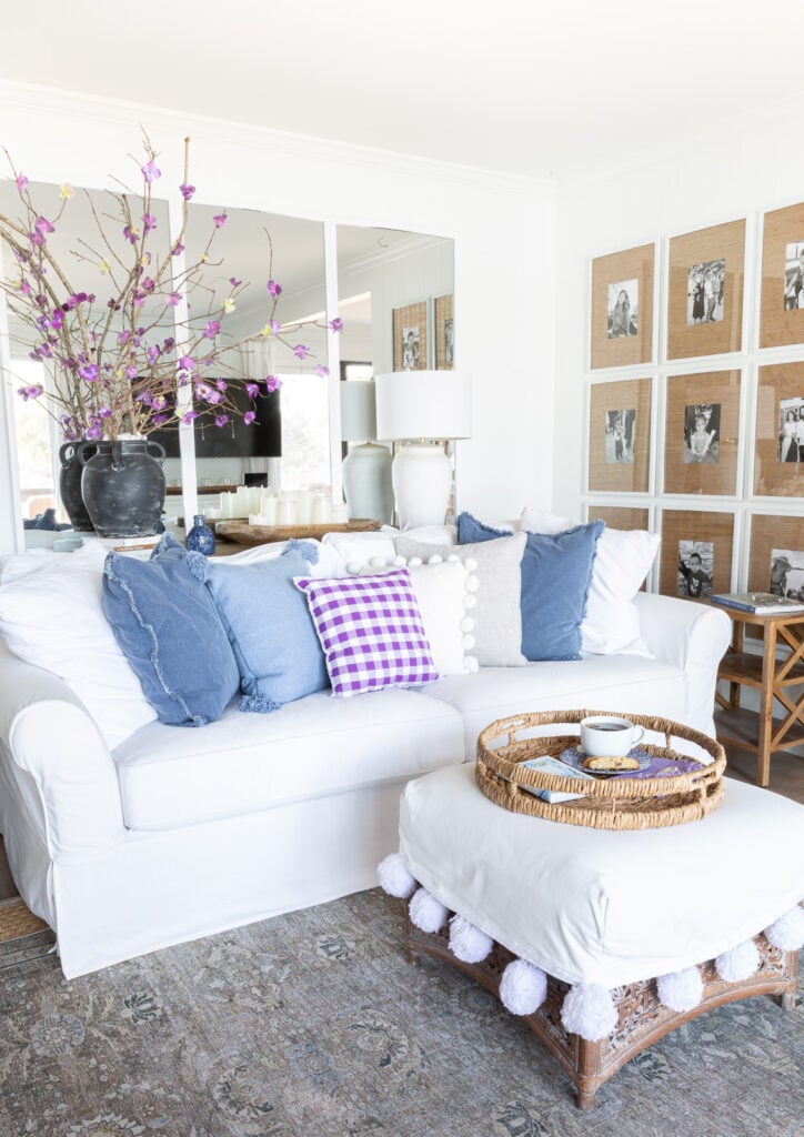 Corner of white wall living room with blue and purple accents.