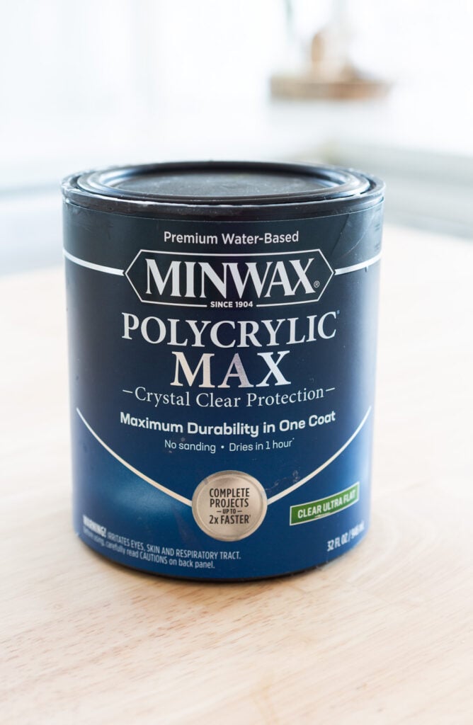 A quart can of Minwax Polycrylic Max on top wood counter.