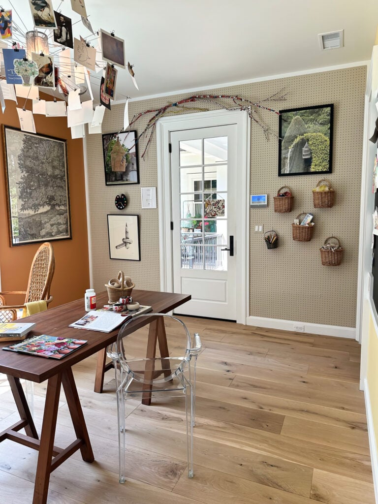 craft room wall covered with pegboard panels