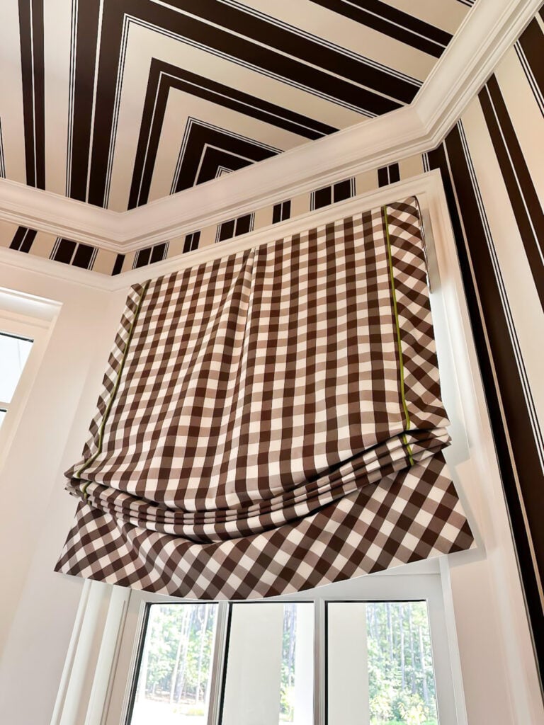 Brown and white check Roman shades in entry at the Southern Living Idea Home 2025