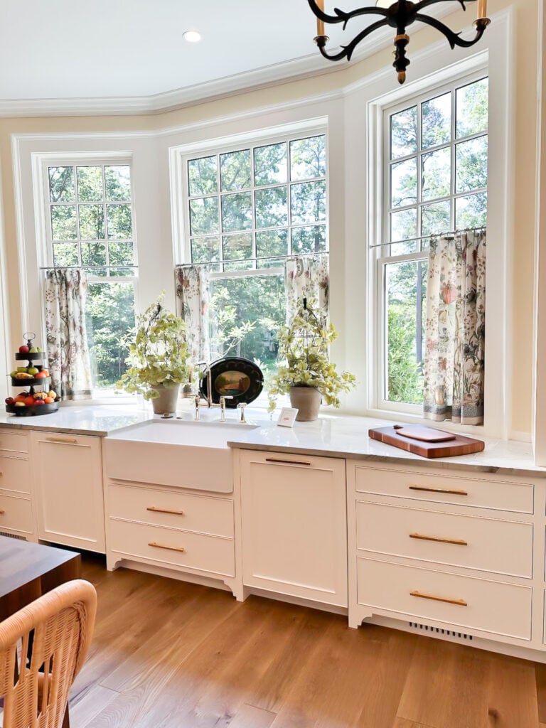 Southern Living 2025 Kitchen sink area with large windows.