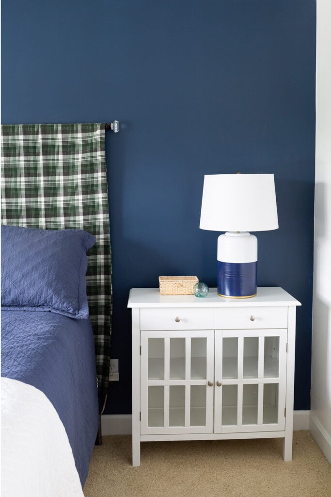 blue and white guest room with green accents
