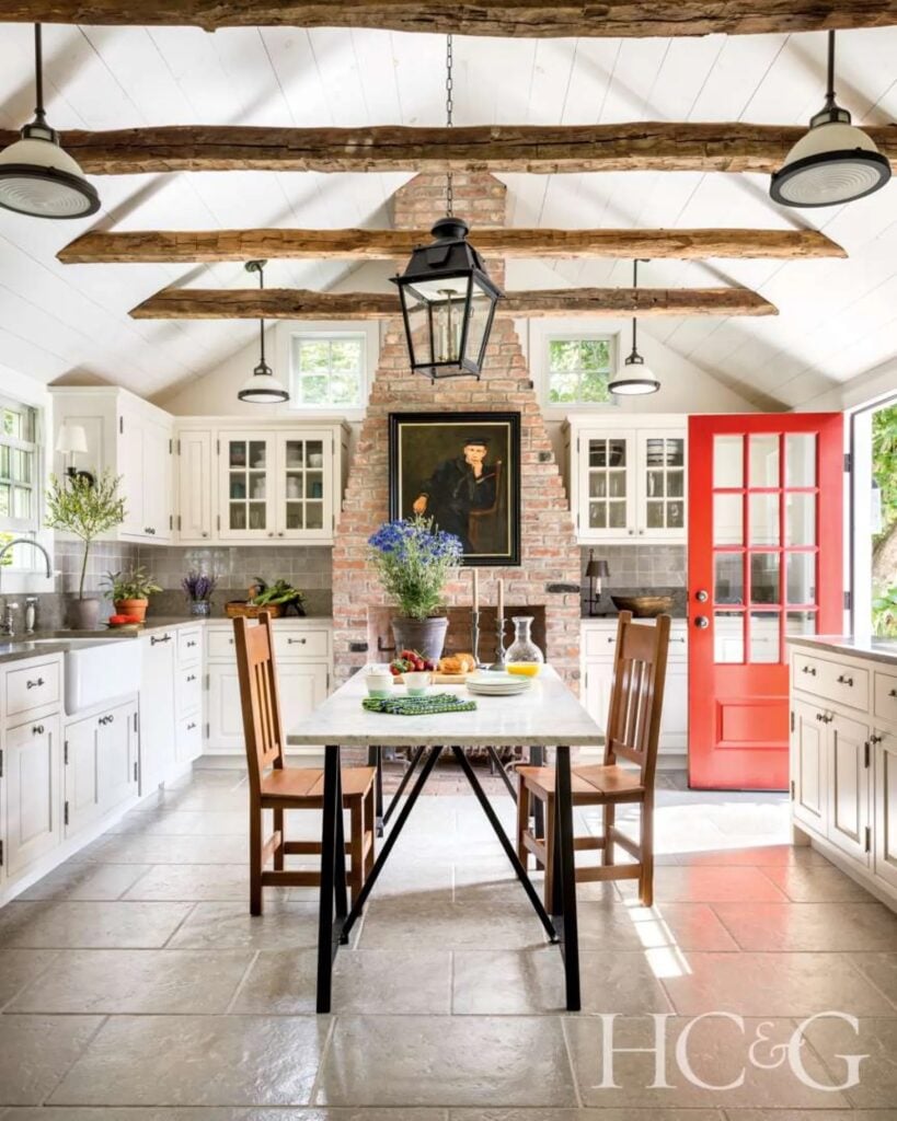 historic kitchen with beam and brick fireplace as a focal point
