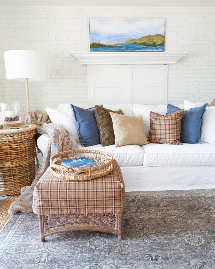 White blue and brown living room getting layers of fall decor started.