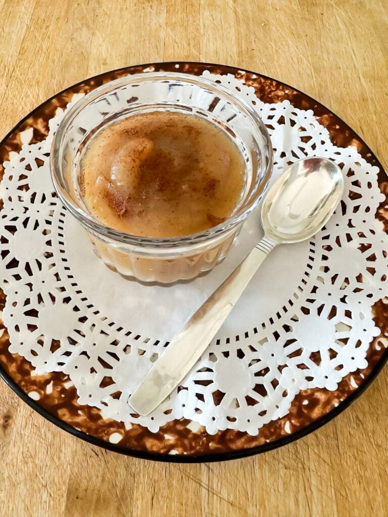 No sugar instant pot homemade applesauce on a doily lined plate.