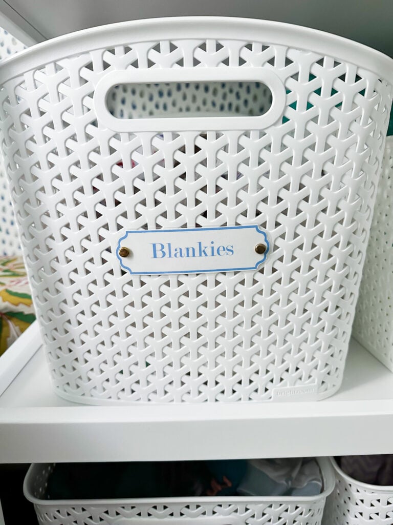 close up of a baby nursery label on a white plastic basket