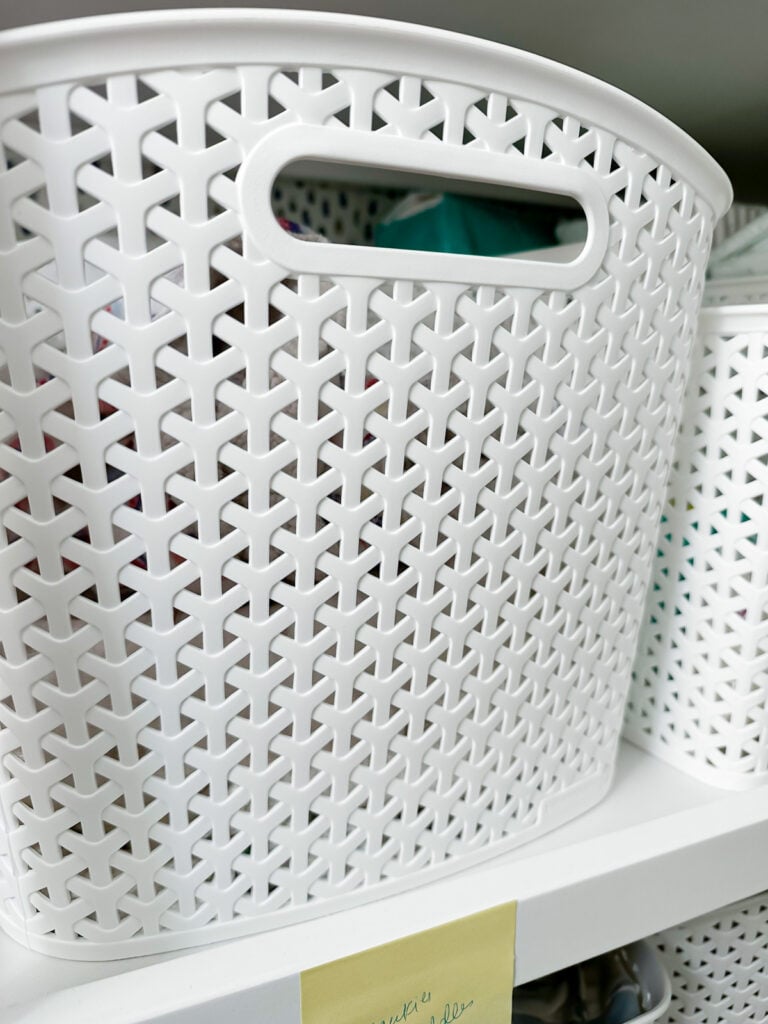 close up of a white plastic storage basket from Target without a label.
