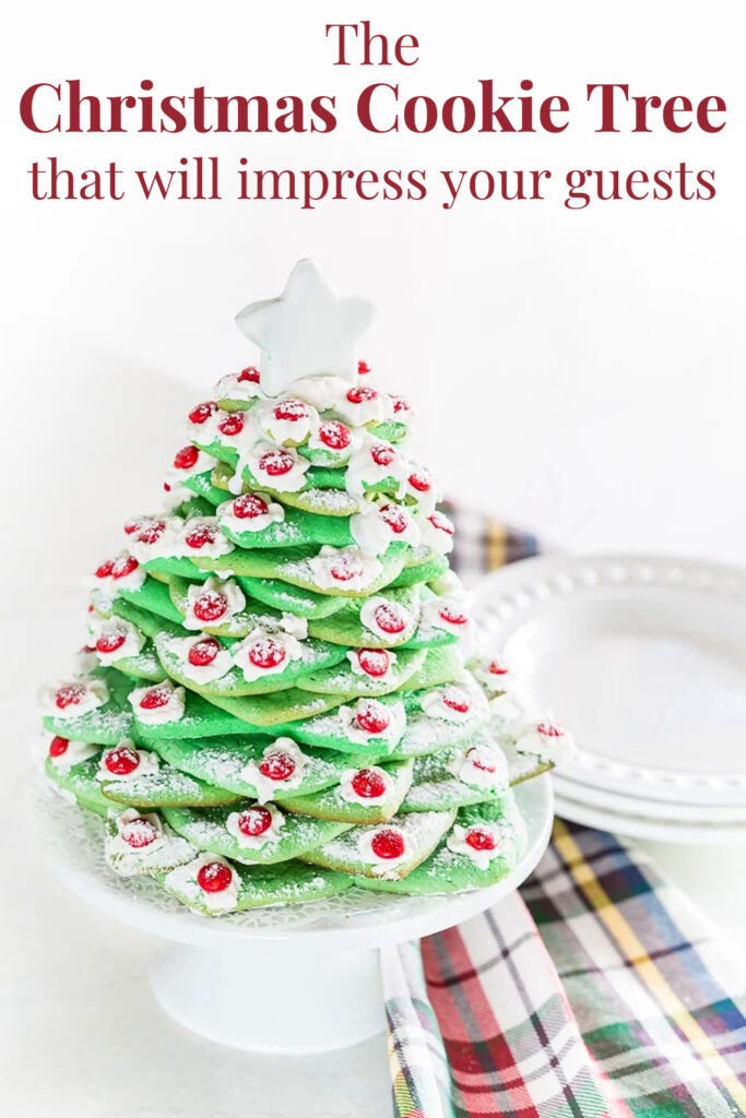 a Christmas cookie tree on a kitchen counter with a plaid dishcloth nearby. Text overlay says - The Christmas cookie tree that will impress your guests.