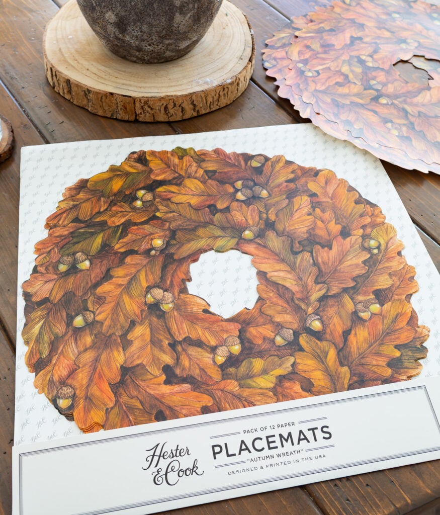 A package of 12 paper Autumn Wreath paper placemats by Hester & Cook.