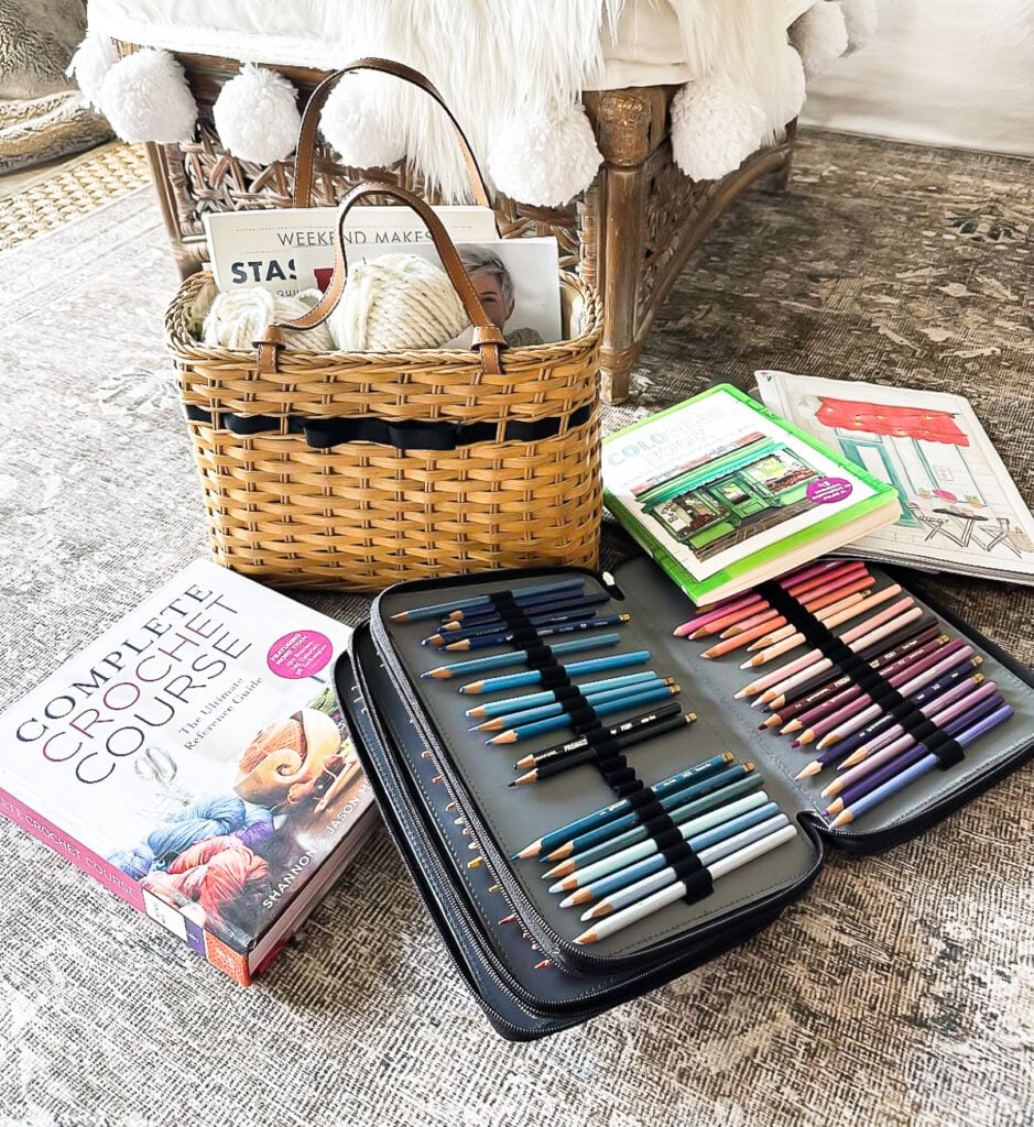 contents of what is in my analog basket - crochet book, colored pencils, magazines and yarn