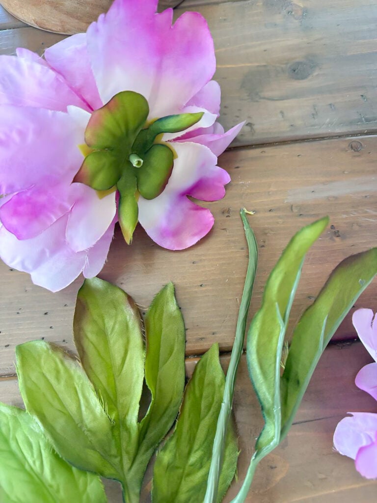 close up of pulled off a faux flower head from the stem