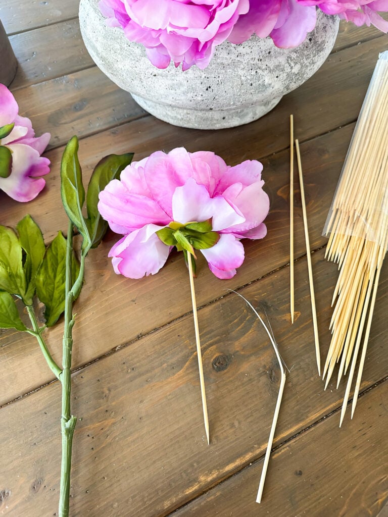 how to remove a faux flower head from a stem and then style it a different way.