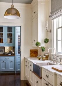 creamy white cabinet kitchen with a blue cabinet butler's pantry