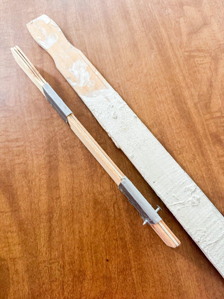 DIY wall art hangers that make hanging art easy and precise.
