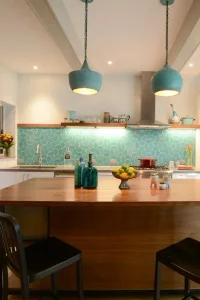 Beautiful kitchen with blue lights and backsplash