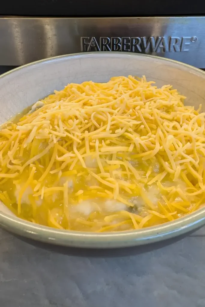Shepherd's pie with shredded cheese in a bowl