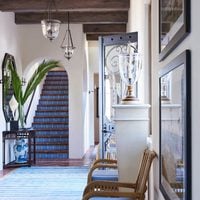 Entry room with blue steps leading to a second floor