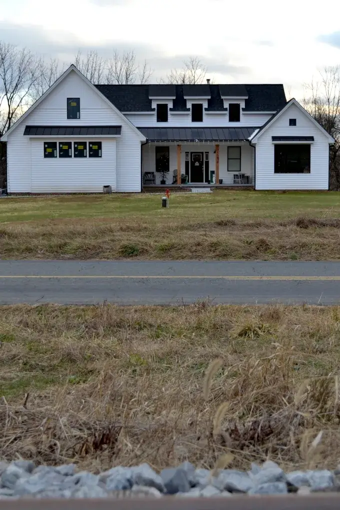 White farmhouse style home with black trim