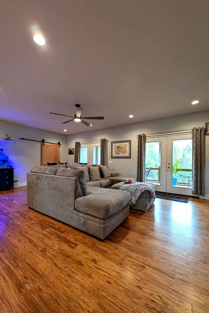 View of the living room with a gray couch in the center